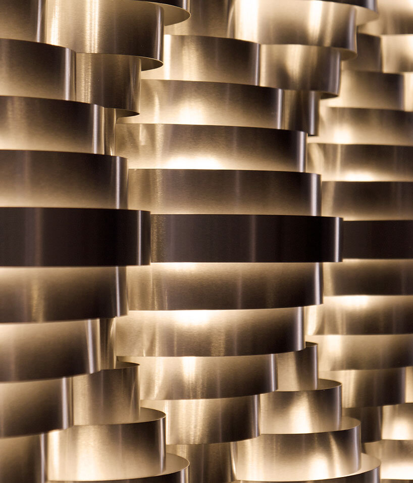 The modular system scales from a single residential light source into multi-unit geometric wall compositions
