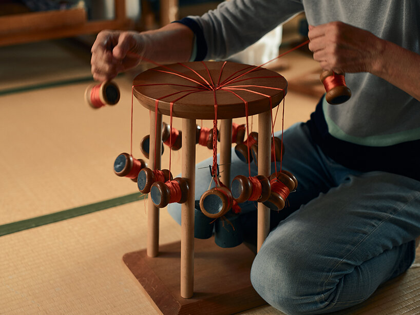 a scene showing the manufacturing of kumihimo