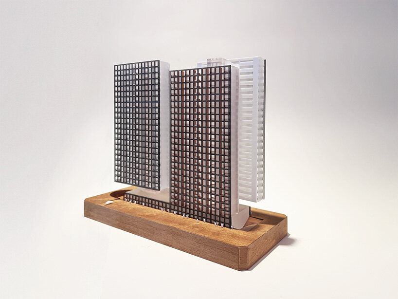 a physical model shows the two proposed towers and their interlocking volumes