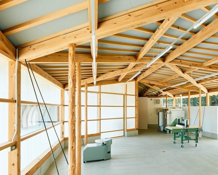 triangular timber structure encloses tsukumo kiln ceramic studio in kobe, japan