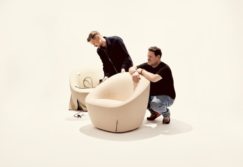 two people building a chair