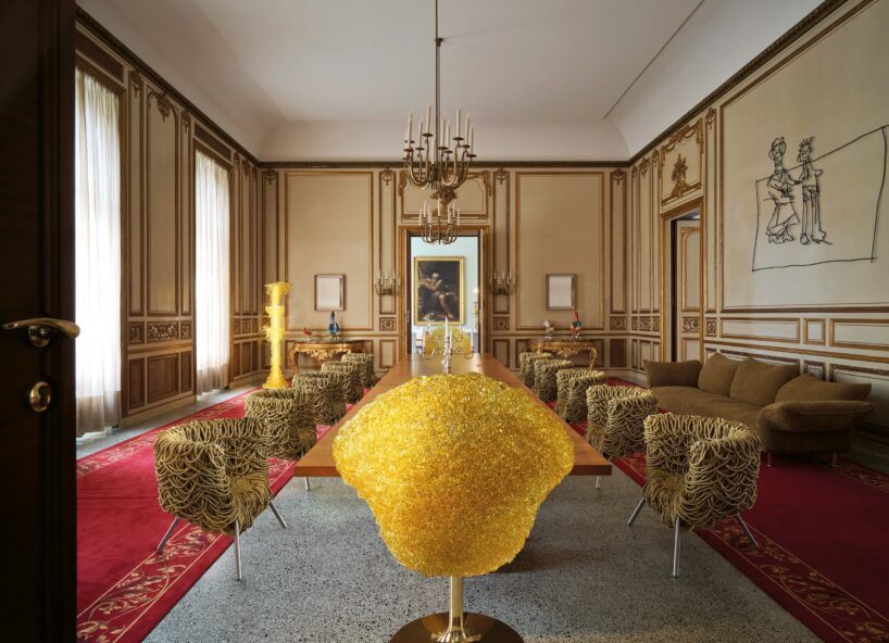 a dining room with a yellow chair