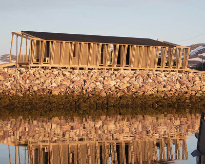 reclaimed timber frames shape skroget coastal sauna and community hub in norway