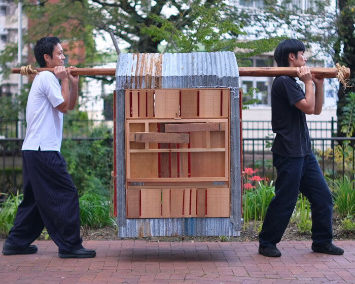 built from upcycled timber and iron, portable micro-barn wanders through japan