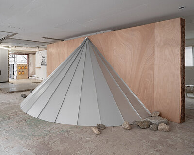 sculptures made of timber and steel occupy raw concrete shell in seoul before demolition