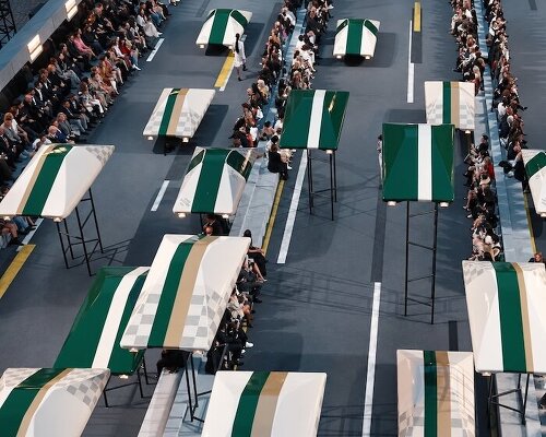 Hovering concept vehicles reshape the Louvre courtyard for Louis Vuitton