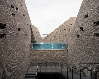 kengo kuma's brick towers frame open-air pools at copenhagen's upcoming bathhouse