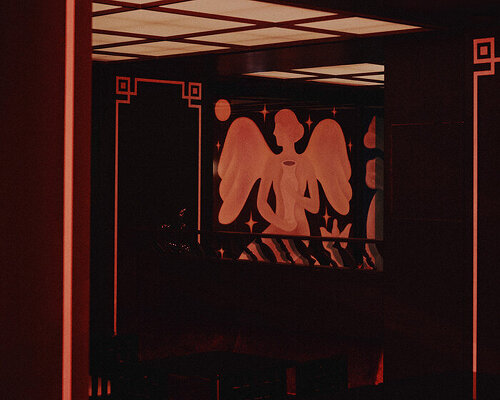 le poisson volant: a red-lit restaurant in paris transforms into a nightclub after dark
