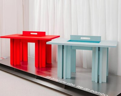 stained bamboo and concealed storage shape MK designers’ handle table