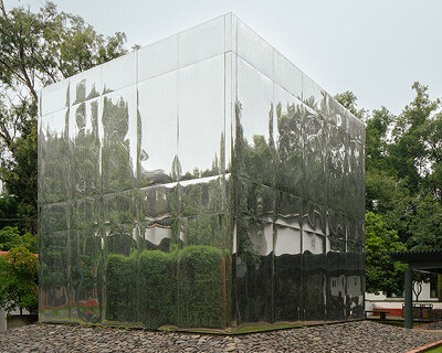 mirrored acrylic skin dissolves cube pavilion into its surroundings in mexico