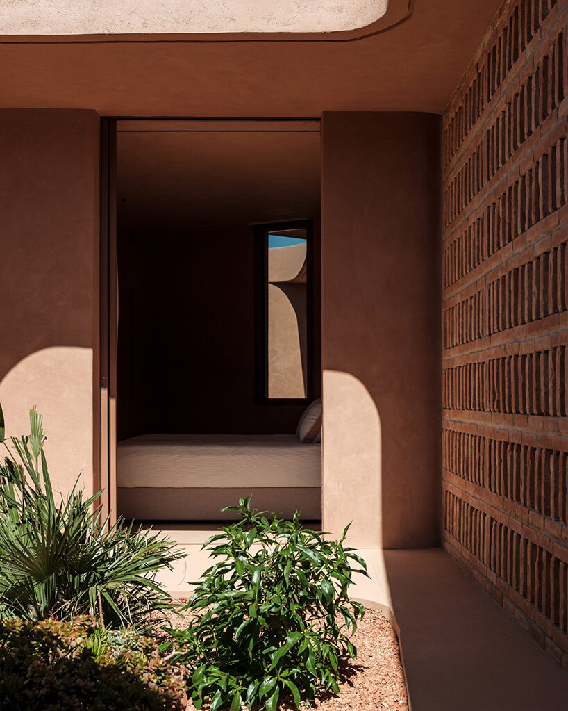 MOLD punctures terracotta-colored greek island ‘M residence’ with seven open-air courtyards - 2