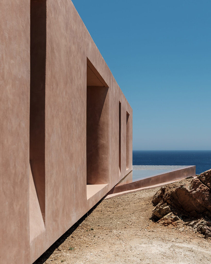 MOLD punctures terracotta-colored greek island ‘M residence’ with seven open-air courtyards - 8