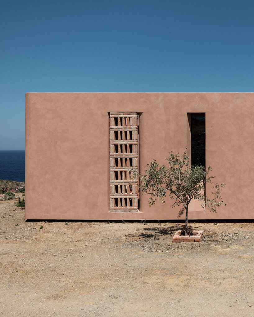 MOLD punctures terracotta-colored greek island ‘M residence’ with seven open-air courtyards - 9