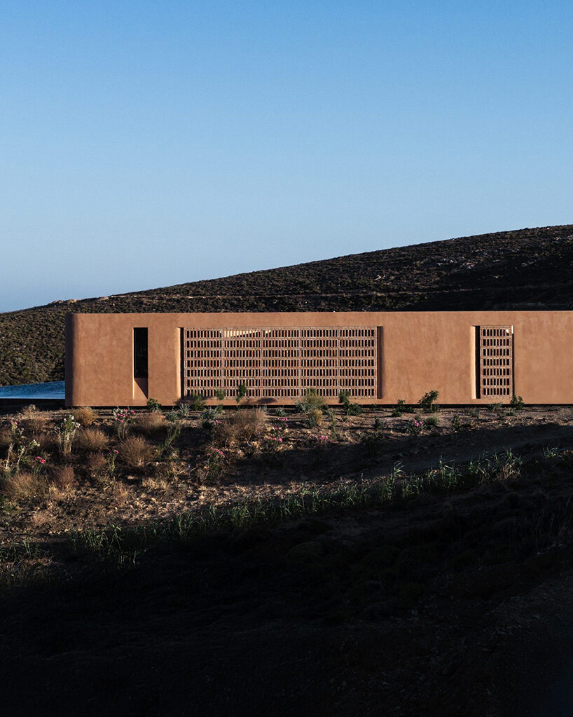 MOLD punctures terracotta-colored greek island ‘M residence’ with seven open-air courtyards - 11