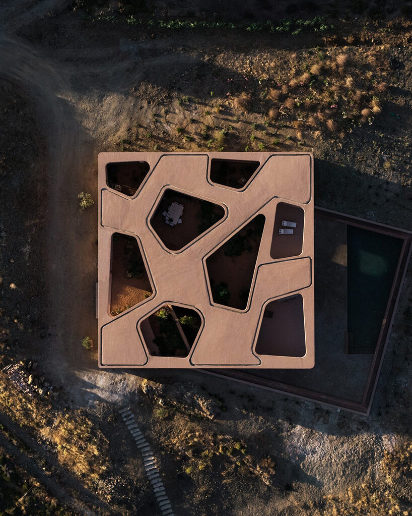 MOLD punctures terracotta-colored greek island ‘M residence’ with seven open-air courtyards - 12