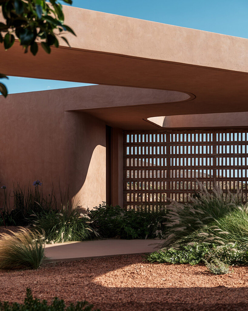 MOLD punctures terracotta-colored greek island ‘M residence’ with seven open-air courtyards - 1