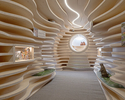 corten steel tubes lined with spruce plywood ribs form alpine learning burrow by officina 82
