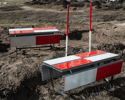 red-and-white aluminum safety barriers convert into public seating at dutch design week