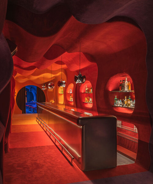 retro cocktail bar with multi-chrome lighting and curved steel hides behind barcelona focacceria