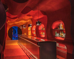 retro cocktail bar with multi-chrome lighting and curved steel hides behind barcelona focacceria