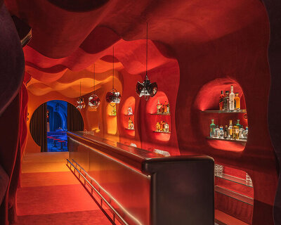 retro cocktail bar with multi-chrome lighting and curved steel hides behind barcelona focacceria