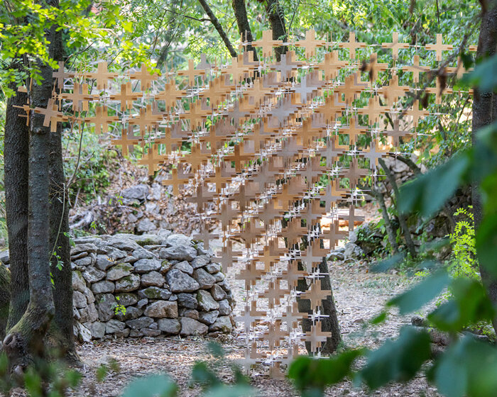 interlocking biodegradable modules weave regenerative pavilion into gavarres landscape